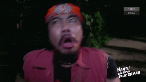 a man with a bandana on his head is making a funny face with the words astro citra in the background