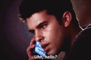 a man talking on a cell phone with the words " uhh hello " above him