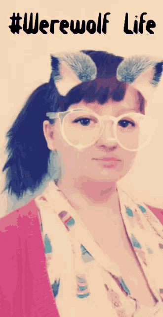 a woman wearing glasses and a ponytail with the words # werewolf life written above her