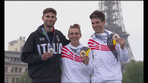 three athletes are posing for a picture and one of them has an italia shirt on