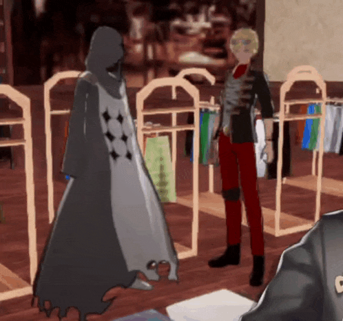 a man in red pants stands next to a man in a black robe