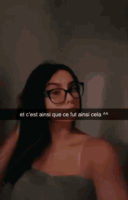 a woman wearing glasses is taking a selfie with the caption " et c'est ainsi que ce fut ainsi cela ^^ "