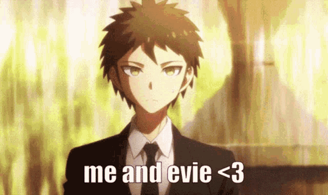 a man in a suit and tie says me and evie < 3