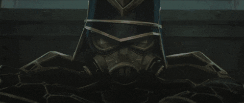 a man wearing a gas mask holds a gun