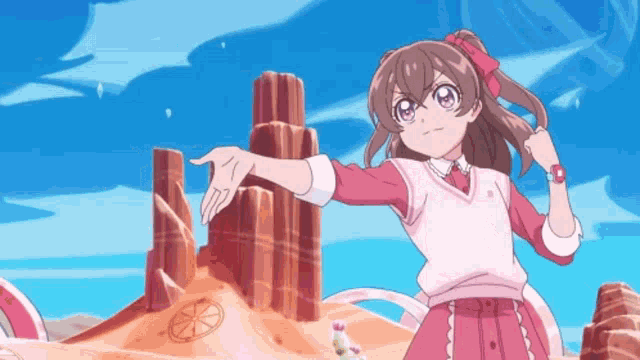 a girl in a pink and white outfit is standing in front of a desert landscape