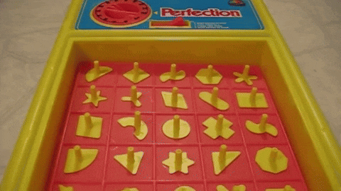 a game called perfection is being played on the table