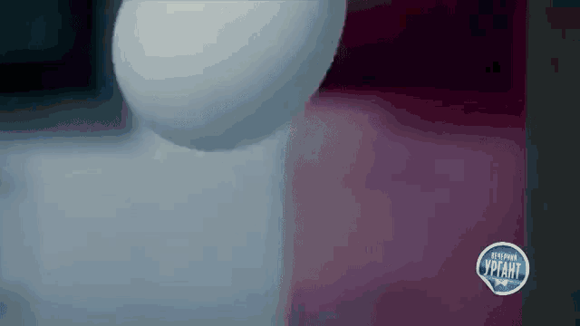 a close up of a snowball being thrown in the air with a sign that says russian yptaht on it .