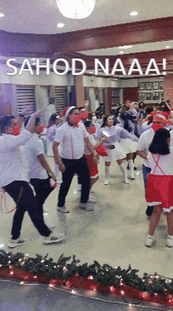 a group of people are dancing in a room with the words sahod naaa written on the bottom
