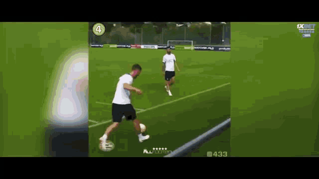 a soccer player is kicking a soccer ball on a field .