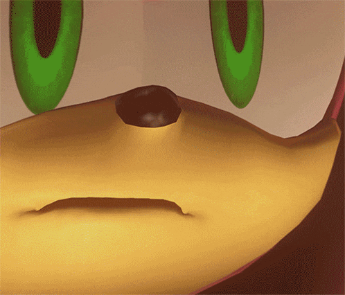 a close up of a sonic the hedgehog 's face with green eyes