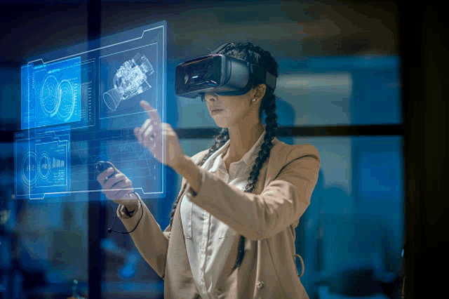 a woman wearing a virtual reality headset looks at a display