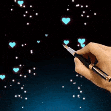 a hand is holding a pen and writing the letter r.