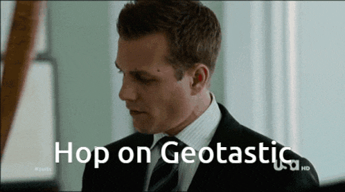a man in a suit and tie has the words hop on geotastic above him