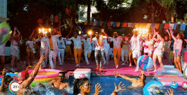a group of people are dancing in a pool with the words zees download now visible