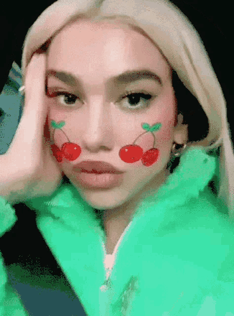 a woman with cherries painted on her face