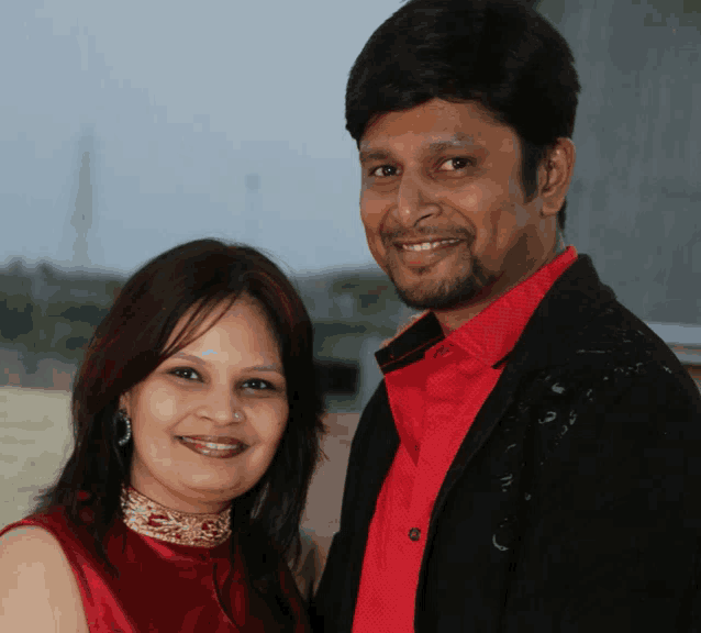 a man and a woman are posing for a picture