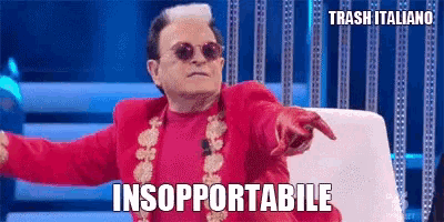 a man in a red suit and sunglasses is pointing at the camera with the words insupportabile written below him .