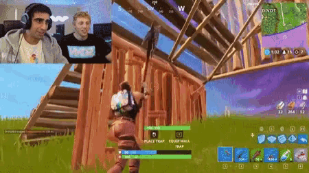 a man and a woman are playing a video game with the word divot on the screen