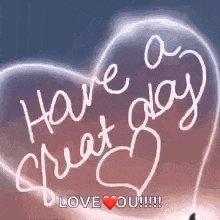 a glowing heart with the words `` have a great day '' written on it .