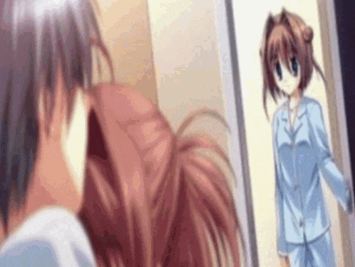 a man and a girl are standing next to each other in front of a door .