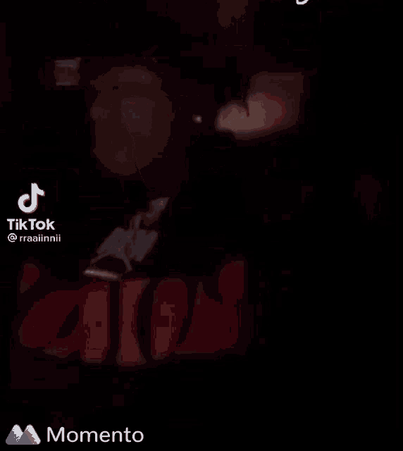 a tiktok video of a man wearing a red hoodie