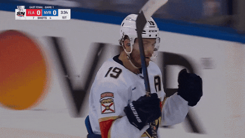 a hockey player with the number 19 on his shirt