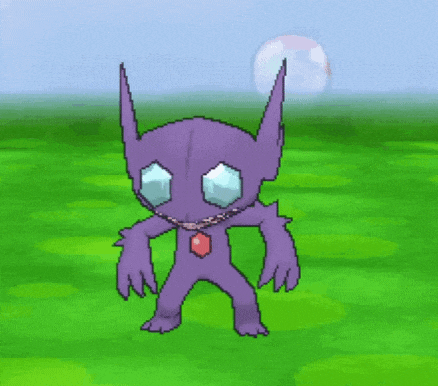 a purple monster with blue eyes is standing in a green field