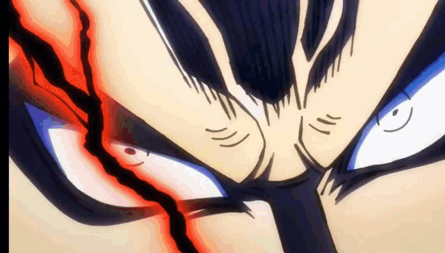 a close up of a cartoon character 's face with a red and blue eye .