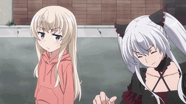 two anime girls are standing next to each other and one is angry