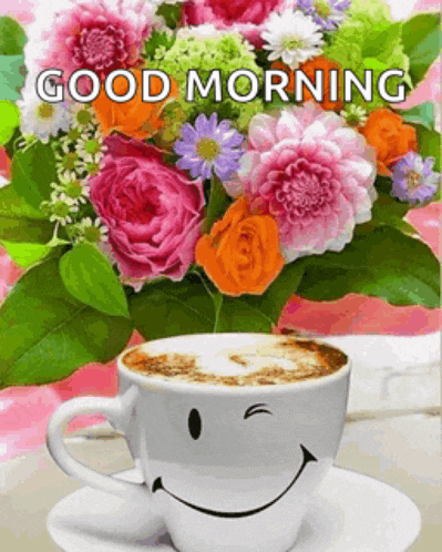 a bouquet of flowers and a cup of coffee with a smiley face