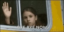 a young girl is waving her hand out of a bus window and says `` bye bye now '' .