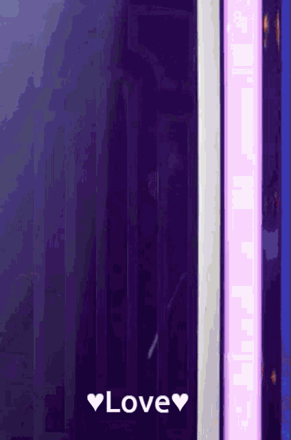 a purple background with a white heart and the word love