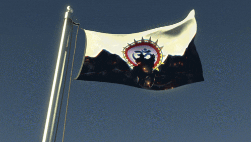 a flag with an om symbol on it flies in the wind