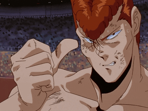 a man with red hair giving a thumbs up