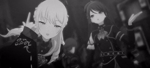 a black and white photo of two anime girls in a dark room .
