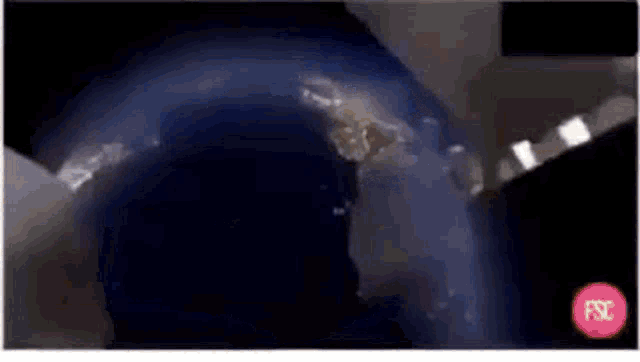 an aerial view of the earth from space with a red circle in the lower right corner .