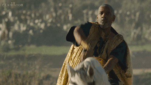 a man riding a horse with the word gladiator written on the bottom