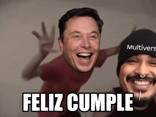 a man wearing a beanie that says multivers is smiling next to another man