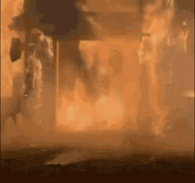 a building is on fire and smoke is coming out of it