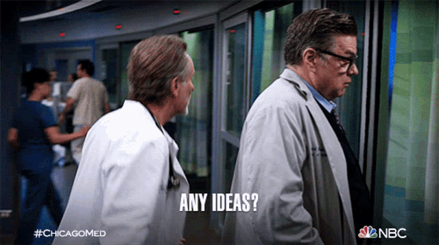 two doctors are walking in a hallway and one of them is asking " any ideas "