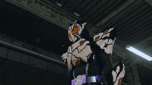 a robot with a purple belt is flying in the air