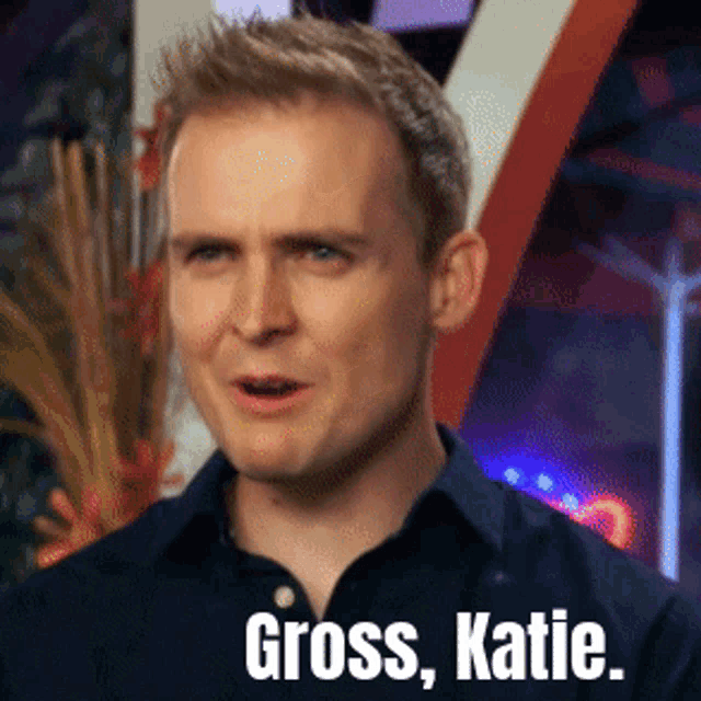 a man in a blue shirt has the words gross katie on his face