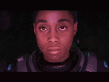 a close up of a person 's face with a red glow