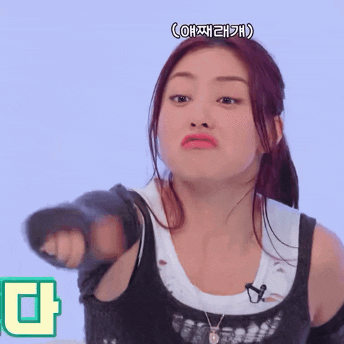 a woman making a funny face with chinese writing on the bottom