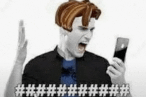 a man with a wig on his head is holding a cell phone and shouting .
