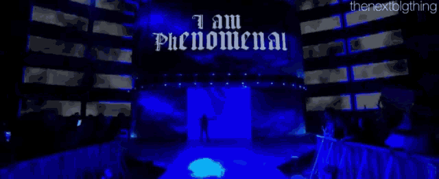 a sign that says i am phenomenal is above a stage