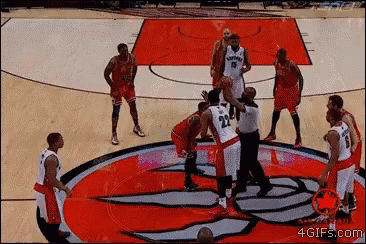 a group of basketball players are playing on a court with the number 22 on their jersey