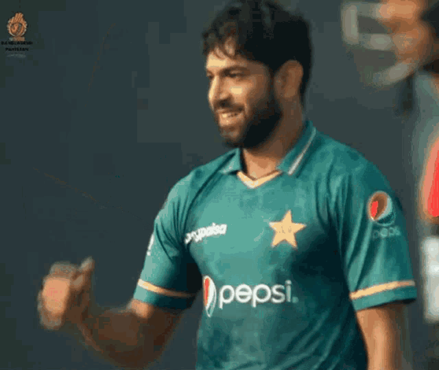 a man wearing a green pepsi jersey with a star on his chest