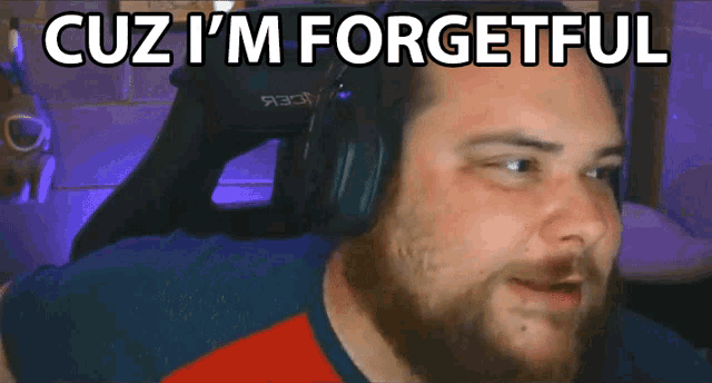 a man wearing headphones with the words cuz i 'm forgetful