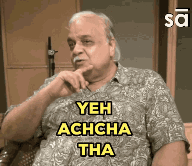 a man with a mustache says yeh achcha tha in yellow letters